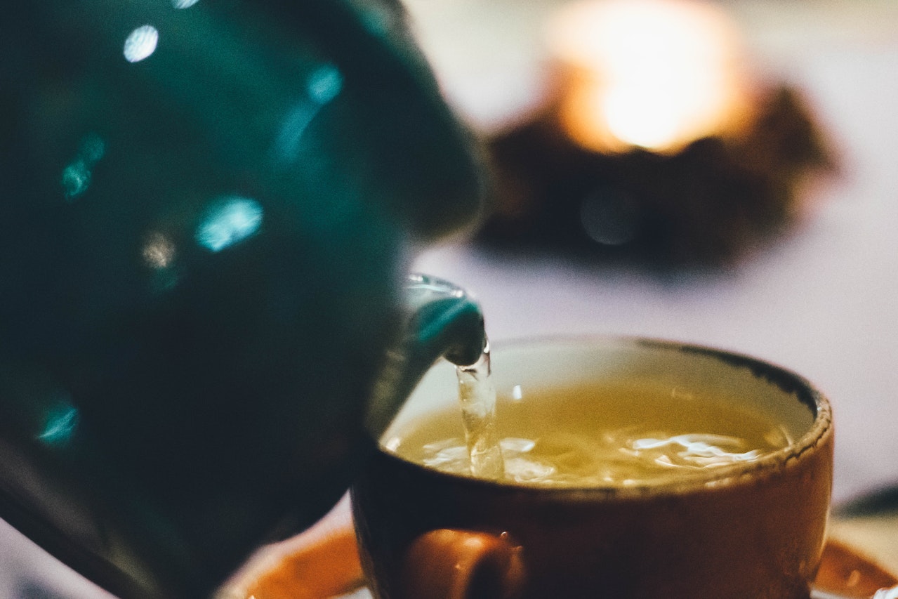 Pouring Jasmine Tea into a cup